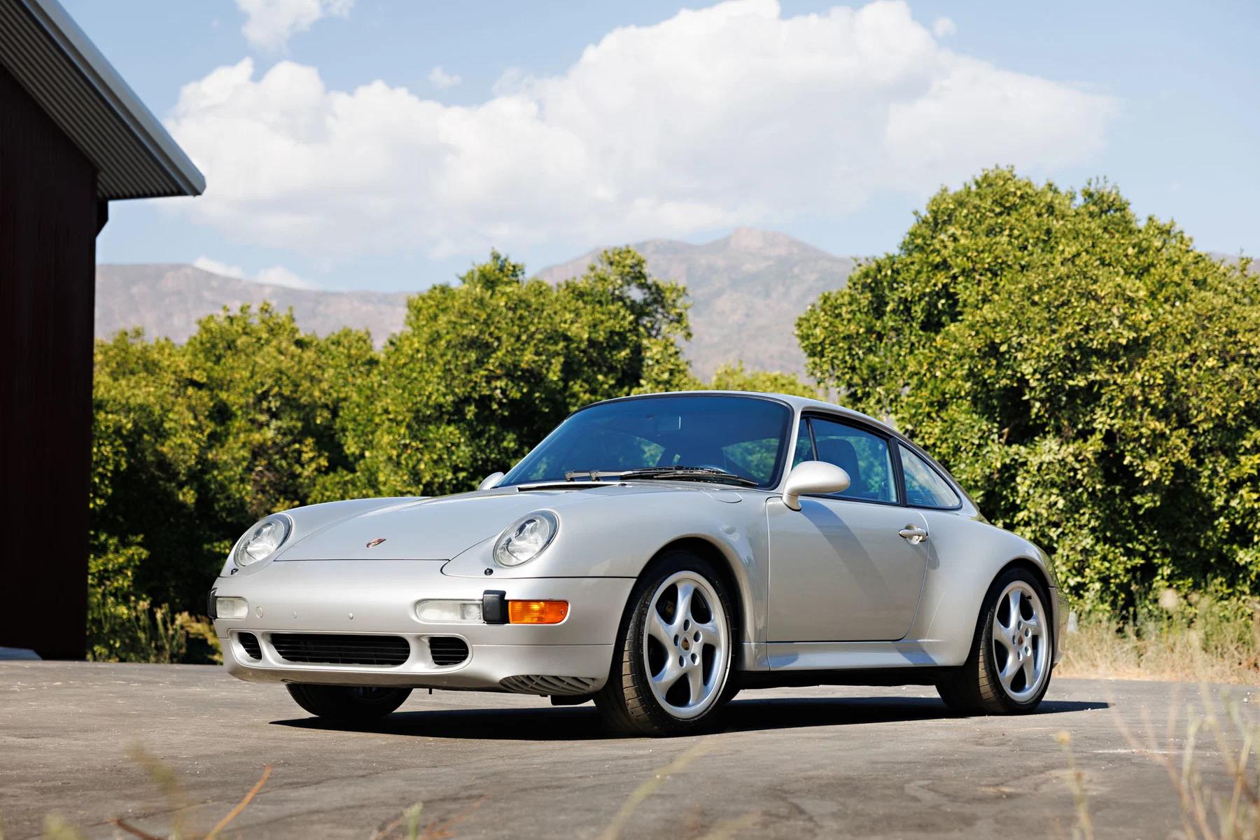 Silver Porsche 911 Carrera S (993 generation), front three-quarter photo